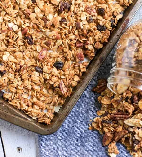 Maple Cinnamon Granola. Sweet maple and a touch of cinnamon make this crunchy granola perfect as a topping or all by itself! #granola #oats #maple #maplecinnamon #pecans #snacking #healthysnacking #cinnamon #maple