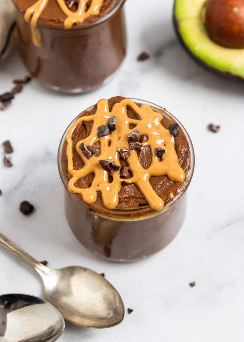 Chocolate Avocado Mousse with peanut butter drizzle and cacao nibs.