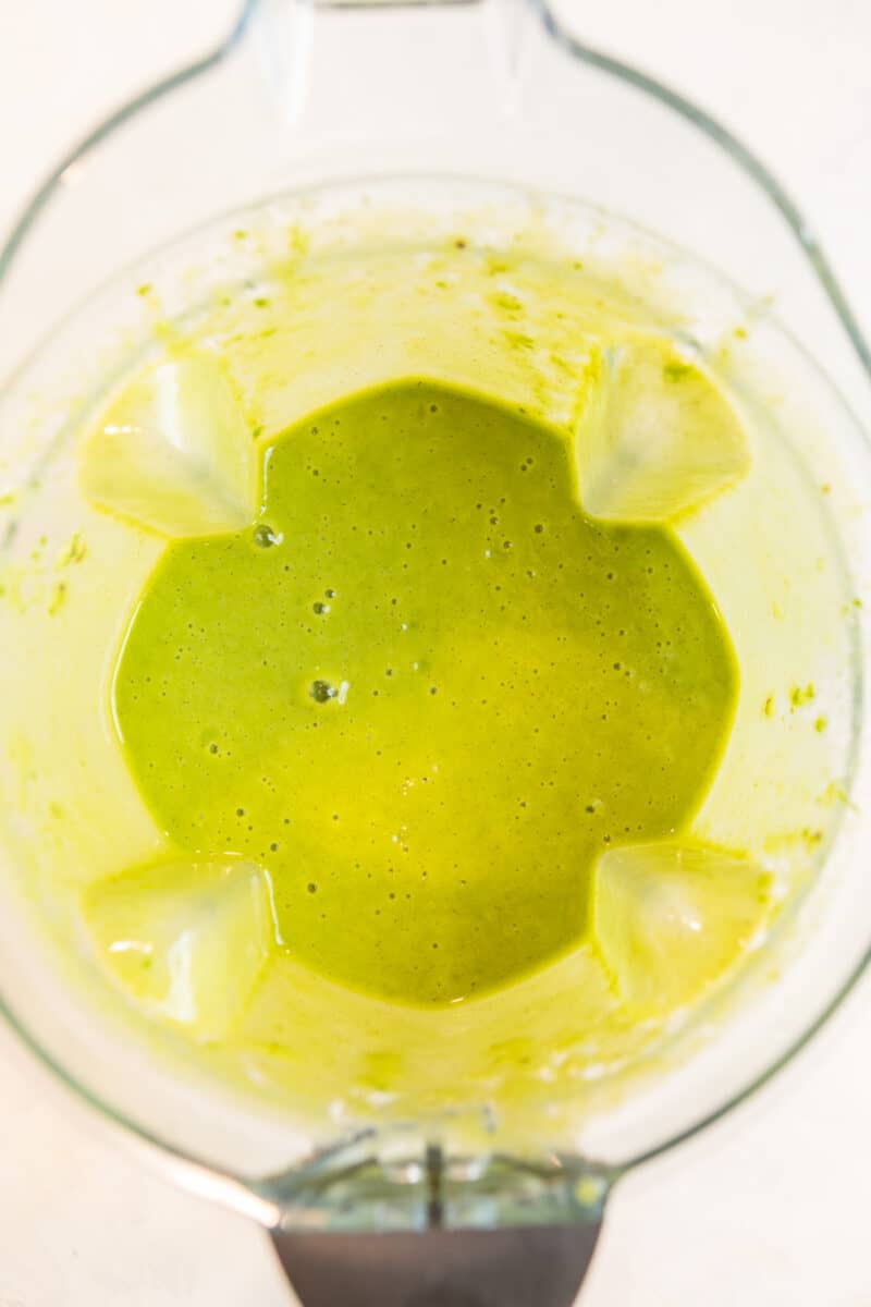 Pineapple kiwi smoothie blended in blender.