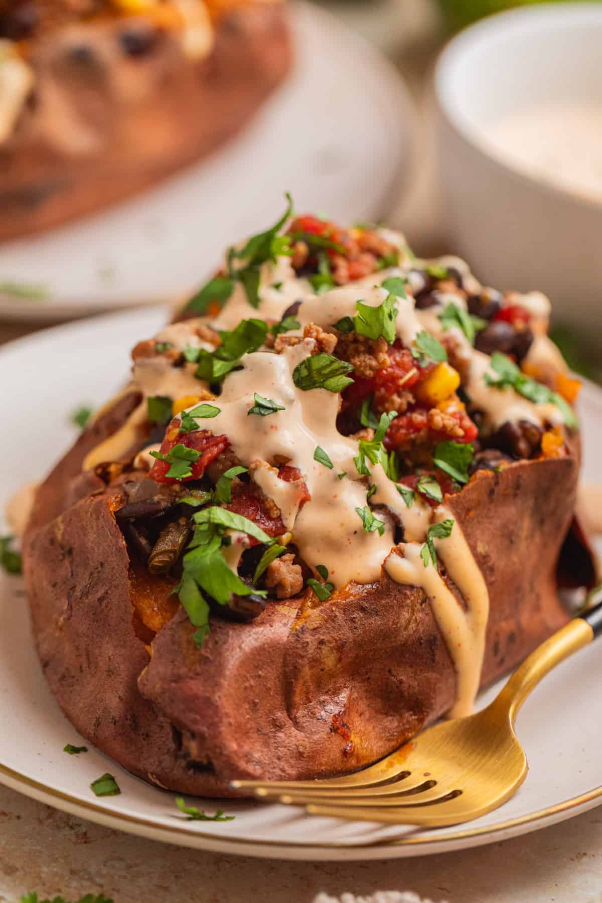 Roasted sweet potato topped with ground turkey taco mixture and cream sauce.