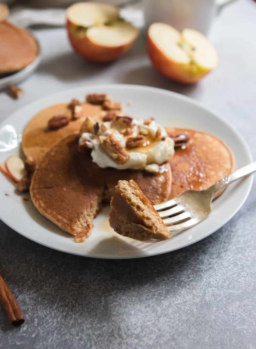 Apple Oatmeal Pancakes on plate with pecans.