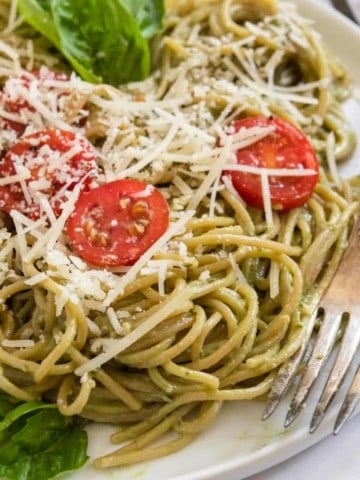 Avocado pesto pasta with fork.