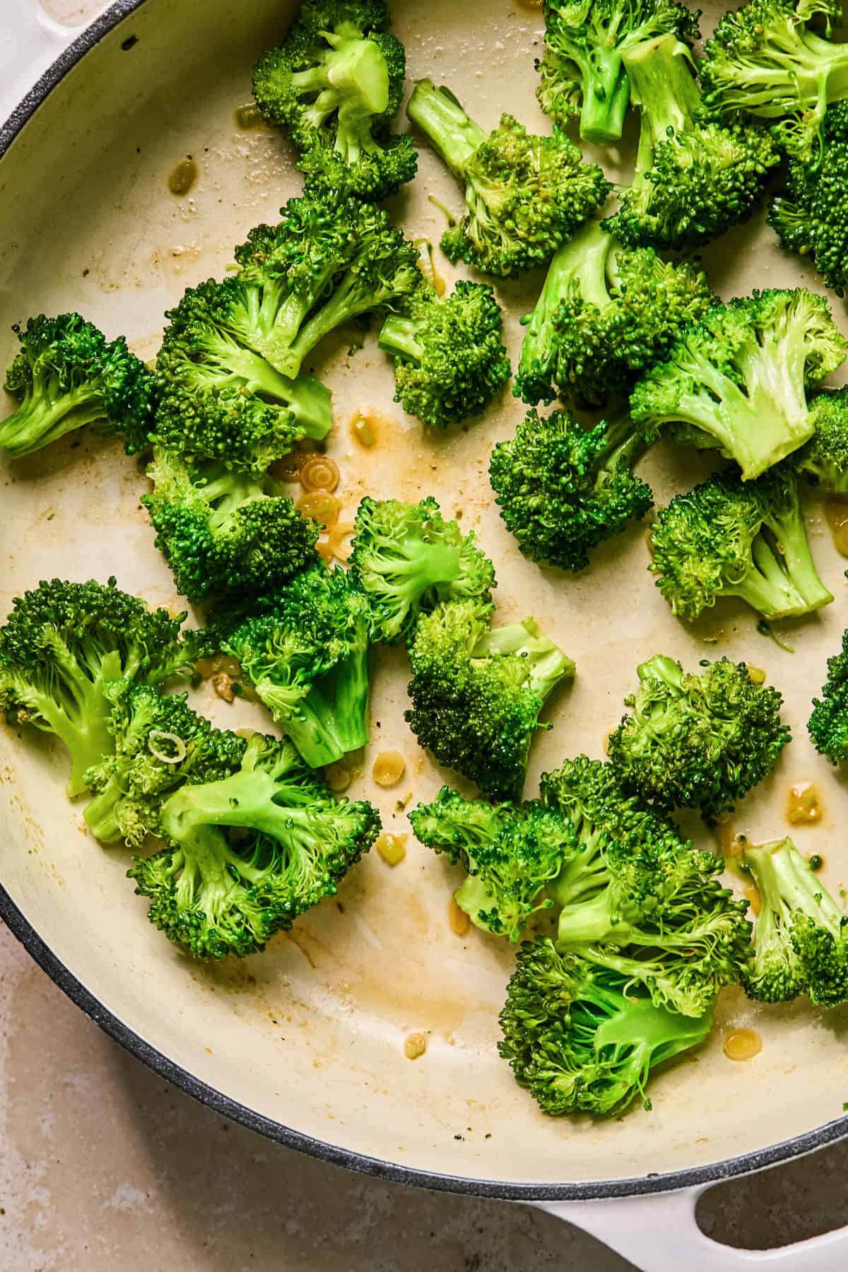 Broccoli stir fried in pan.