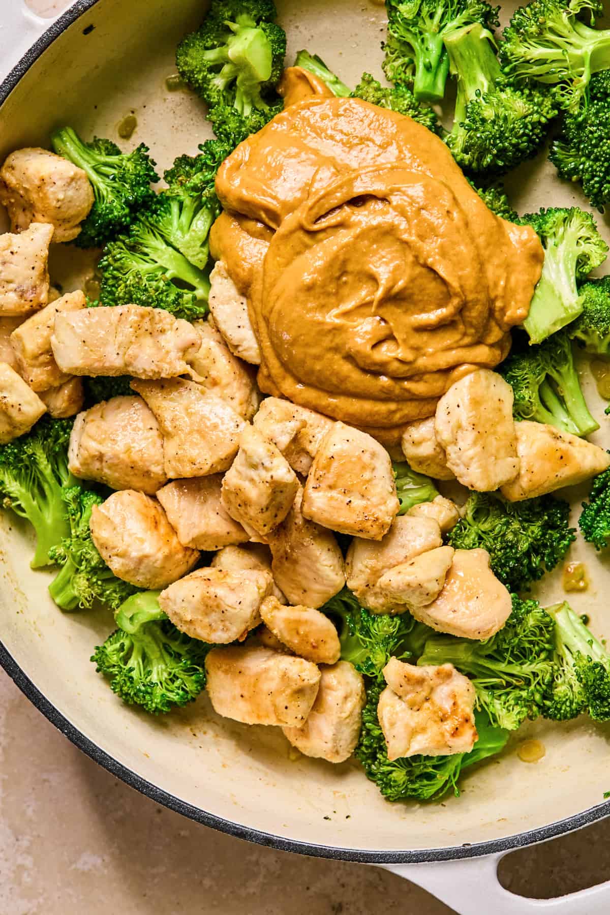 Chicken and peanut sauce added back into pan with broccoli.