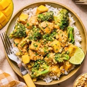 Peanut mango chicken stir fry with rice and broccoli.