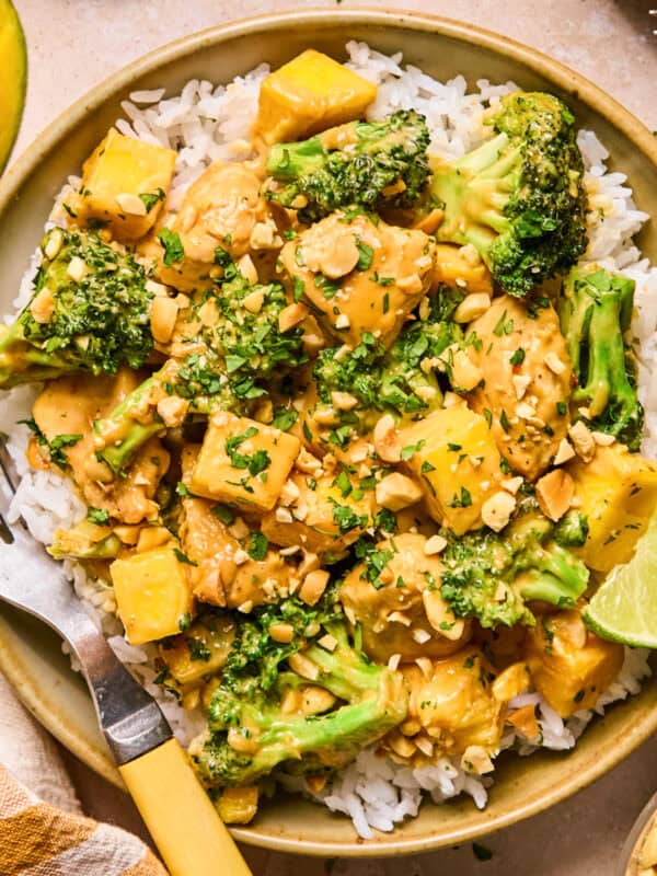 Peanut mango chicken stir fry with rice and broccoli.