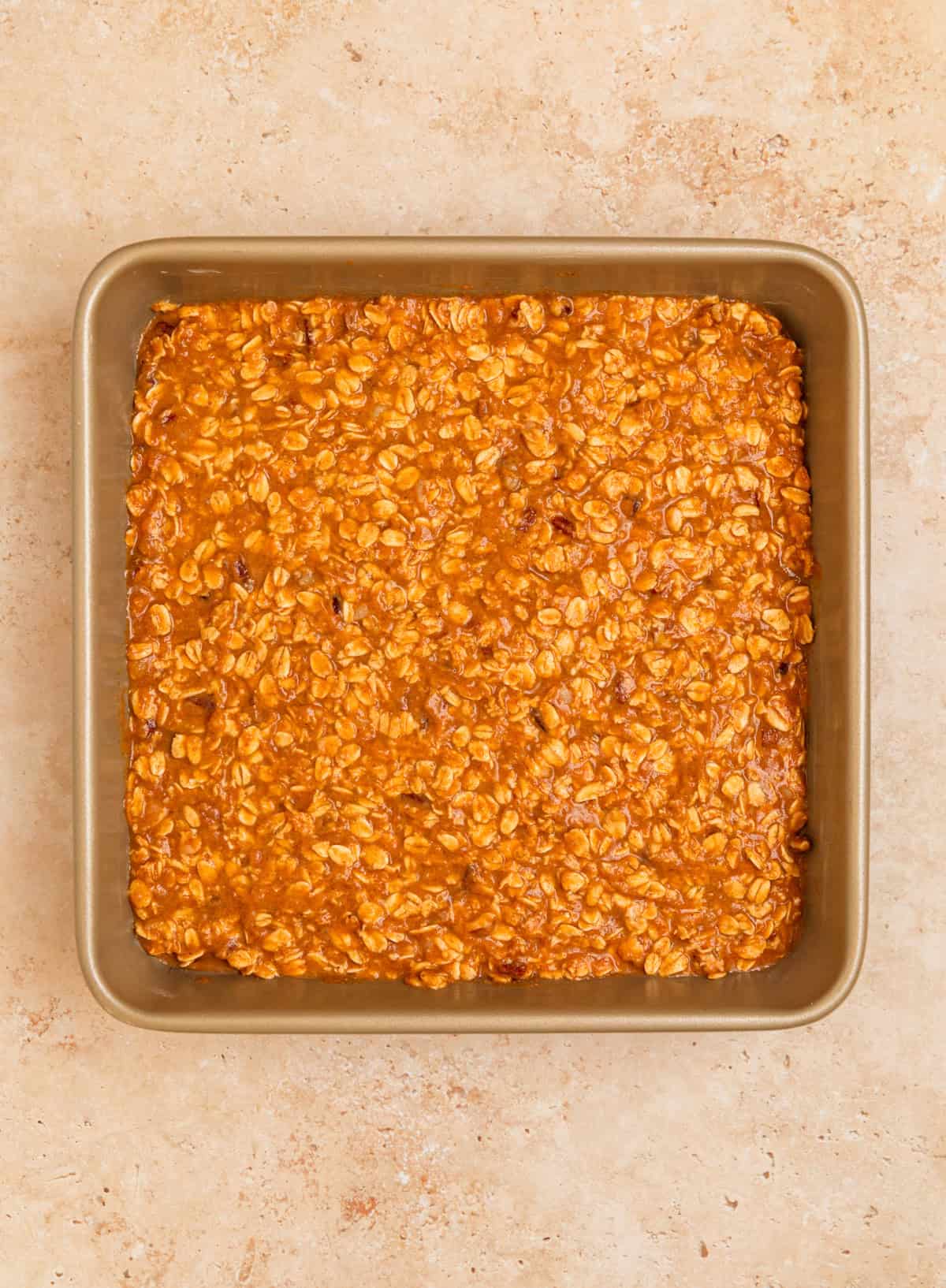 Pumpkin oatmeal mixture in baking pan before baking.