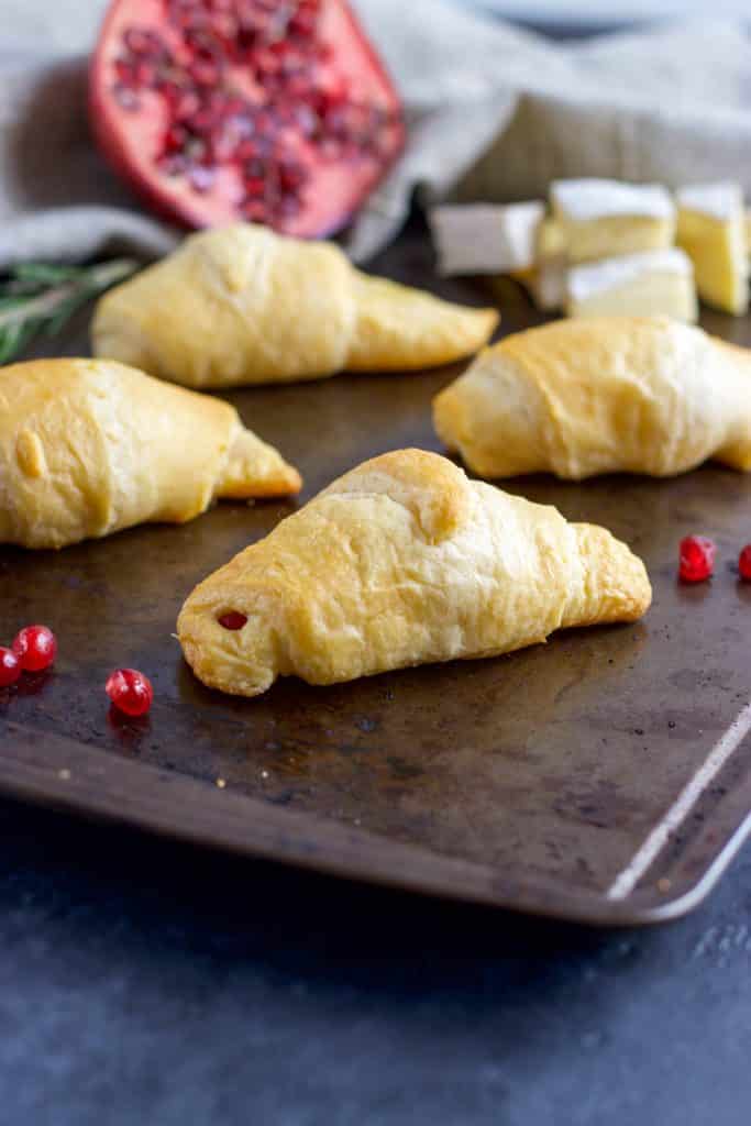 Skip the bread and butter! Add these Pomegranate, Rosemary and Brie Stuffed Crescent Rolls to your dinner and everyone will beg for seconds!