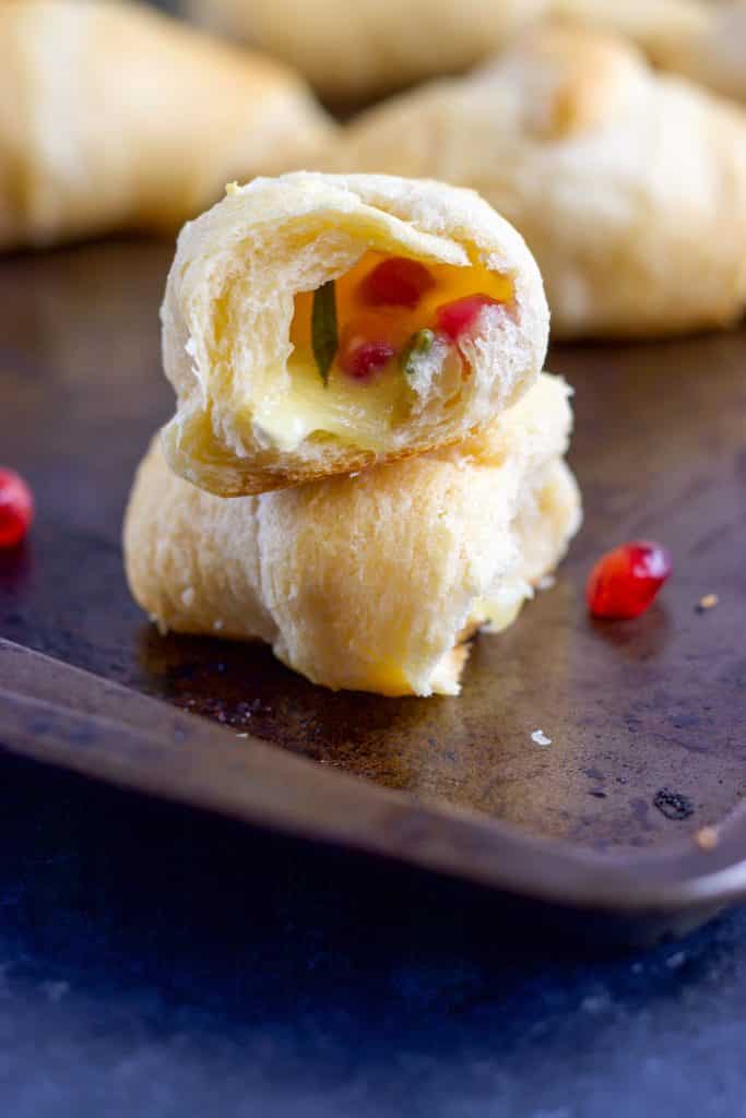 Skip the bread and butter! Add these Pomegranate, Rosemary and Brie Stuffed Crescent Rolls to your dinner and everyone will beg for seconds!