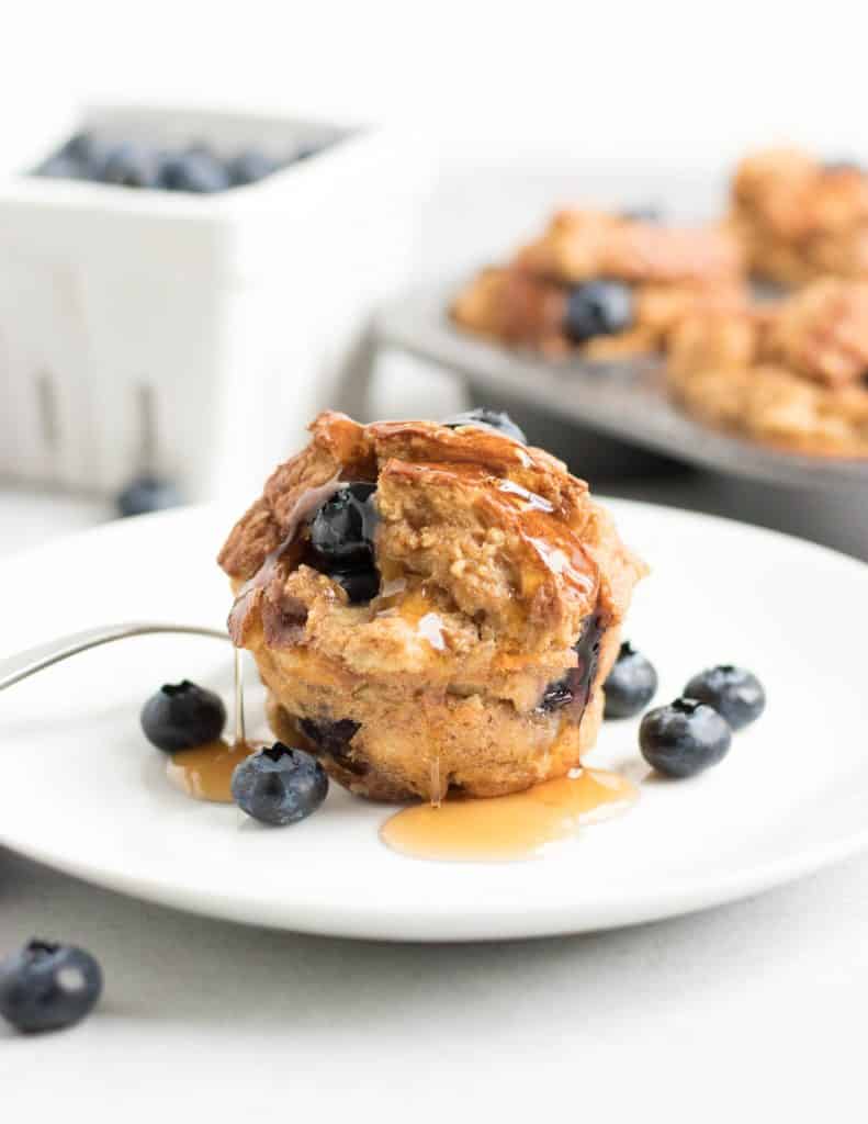 Blueberry Baked French Toast Muffins. French Toast in the form of muffins? Breakfast just upped its game big time. Juicy blueberries and a touch of maple. #frenchtoast #bakedfrenchtoast #breakfast #makeahead