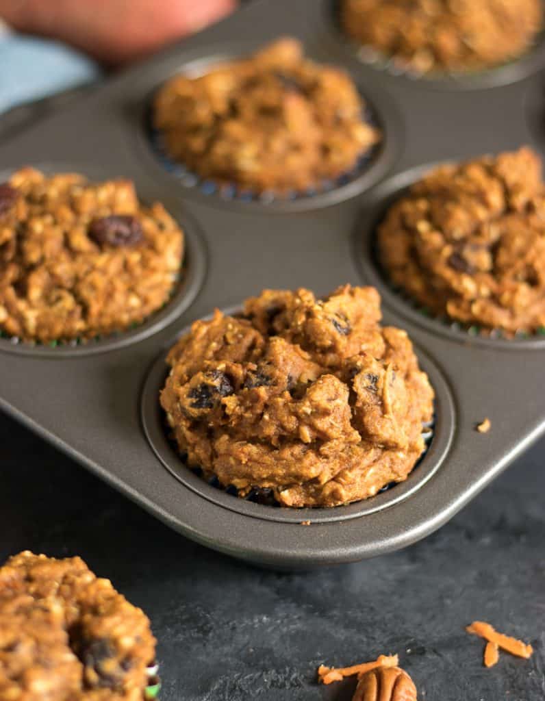 Sweet Potato Morning Glory Muffins. Rise and shine with these fluffy moist muffins packed with carrots, coconut, raisins and pecans--plus sweet potato! Breakfast of champs. #muffins #sweetpotato #morningglory #baking #breakfastrecipe #morningglorymuffin #sweetpotatoes