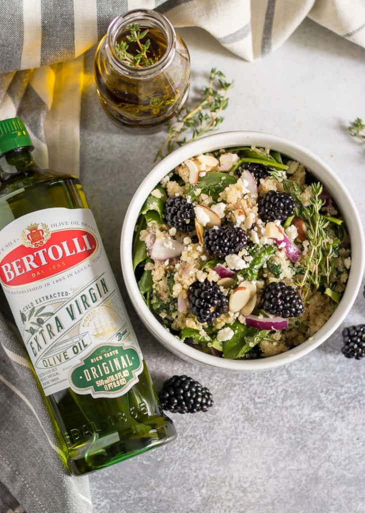 Fresh blackberries and thyme bring all the flavor in this simple Blackberry Spinach Quinoa Salad. Wow your guests by infusing flavors into your olive oil using Bertolli Extra Virgin Olive Oil for that perfect olive oil flavor. #ad #bertolli #oliveoil #salad #spinachsalad #infusedoliveoil