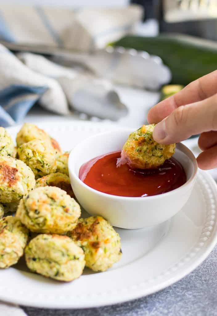 These Cheesy Zucchini Tots are a fun way to get the family to eat some veggies with a smile! They are simple to whip up and perfect for dipping into your favorite sauce!
