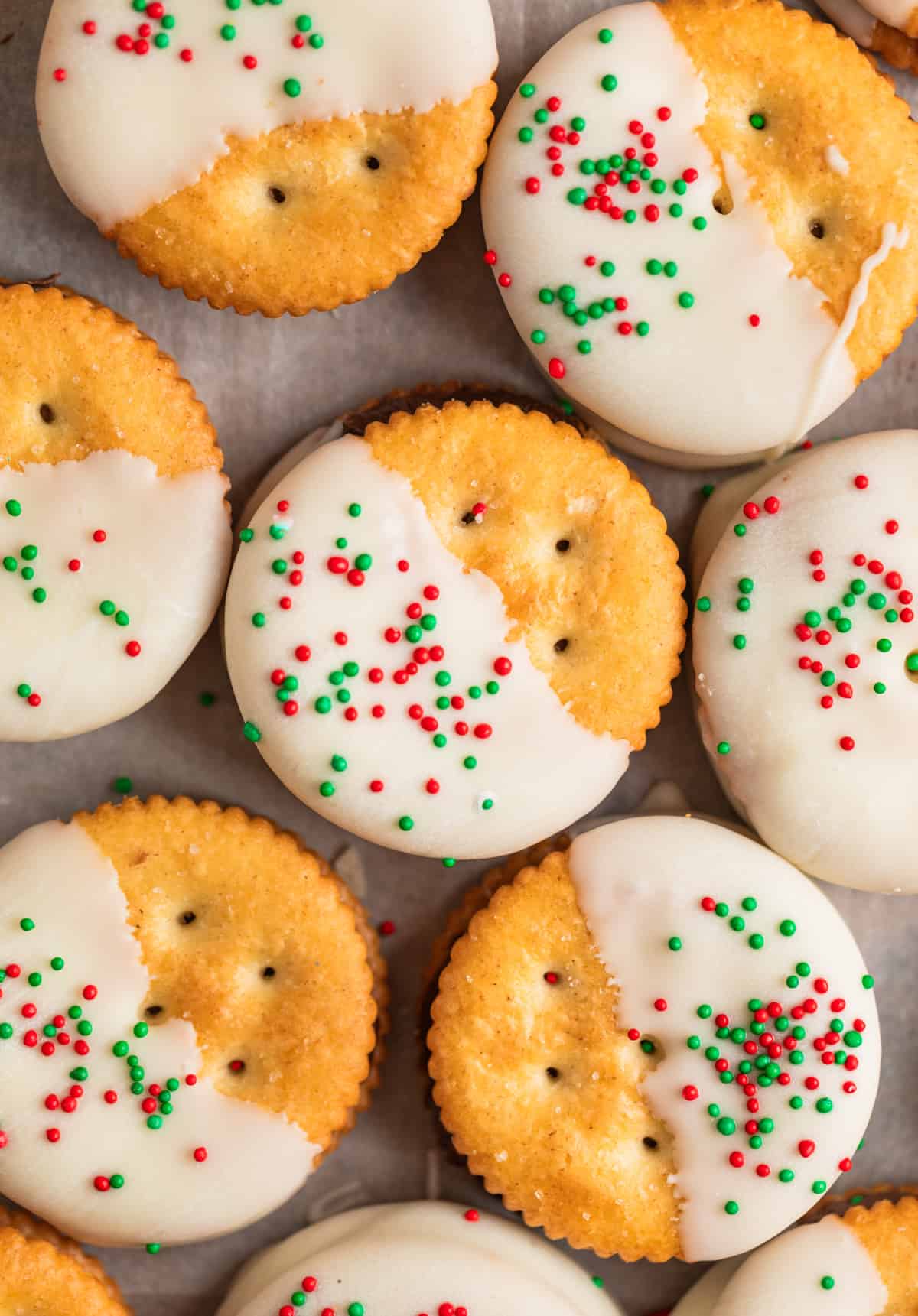 White chocolate dipped crackers with holiday sprinkles.