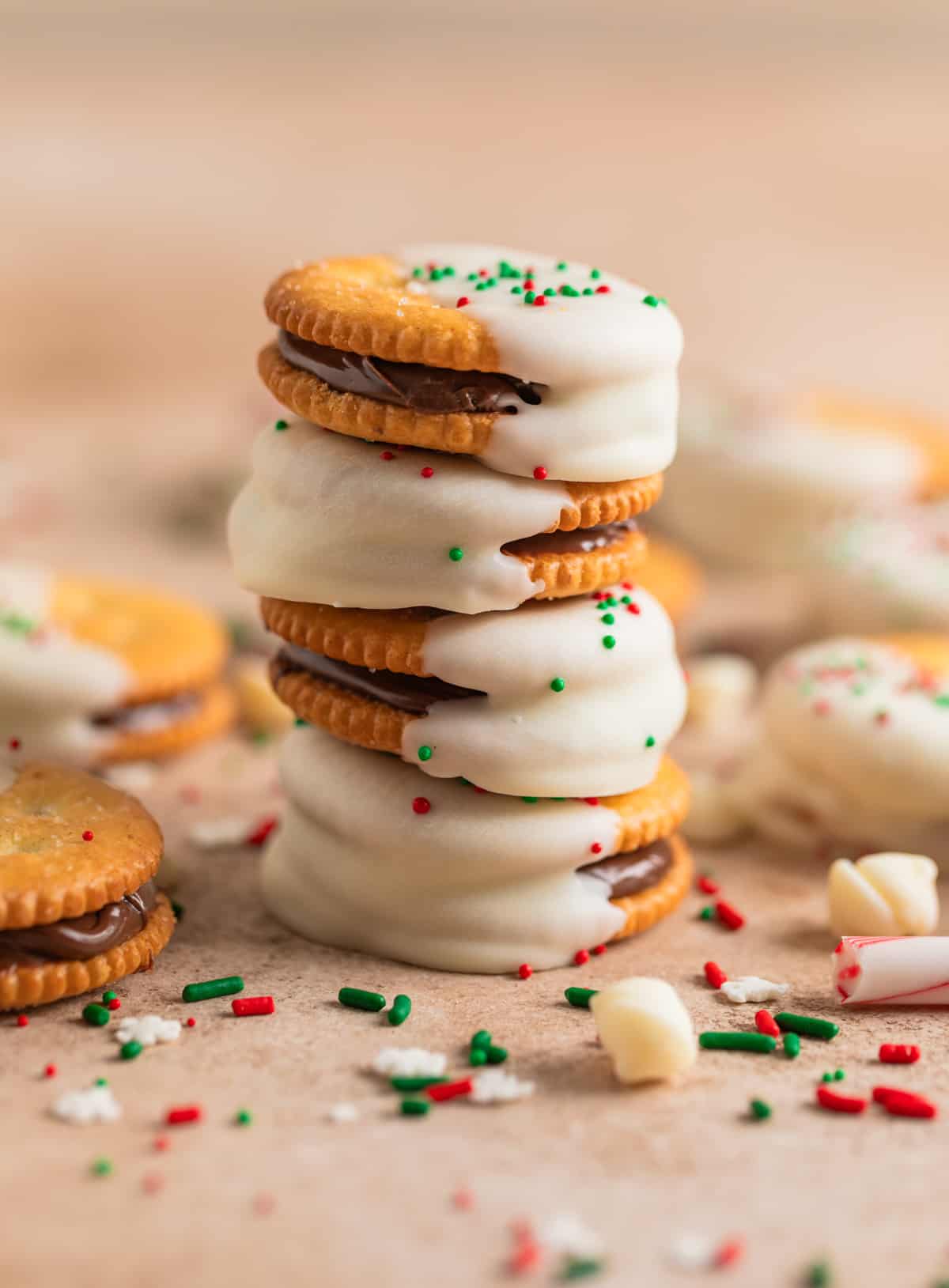 Stack of Christmas no bake Ritz cracker sandwich cookies with Nutella and white chocolate.