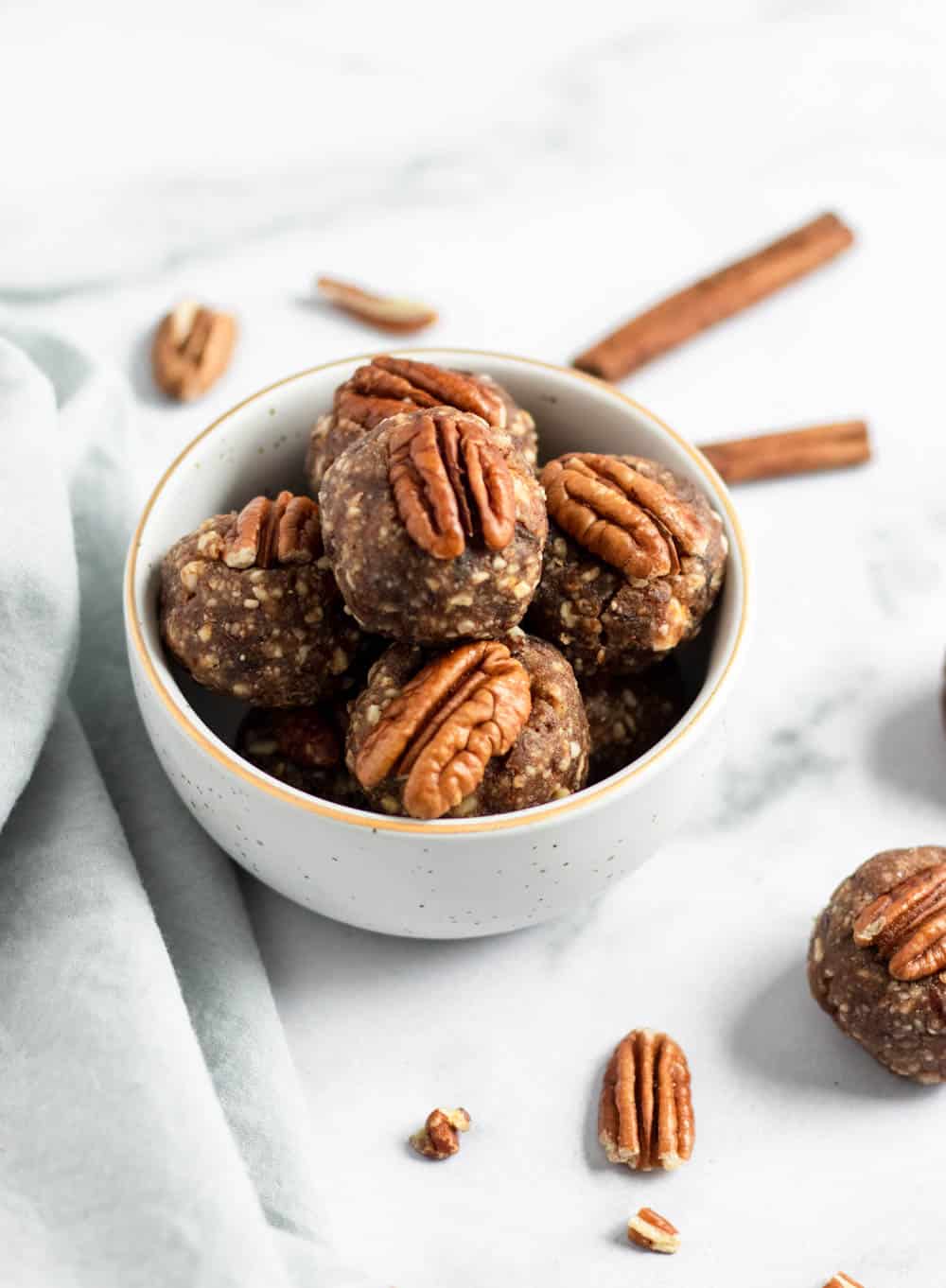 Bowl of energy bites with pecans.