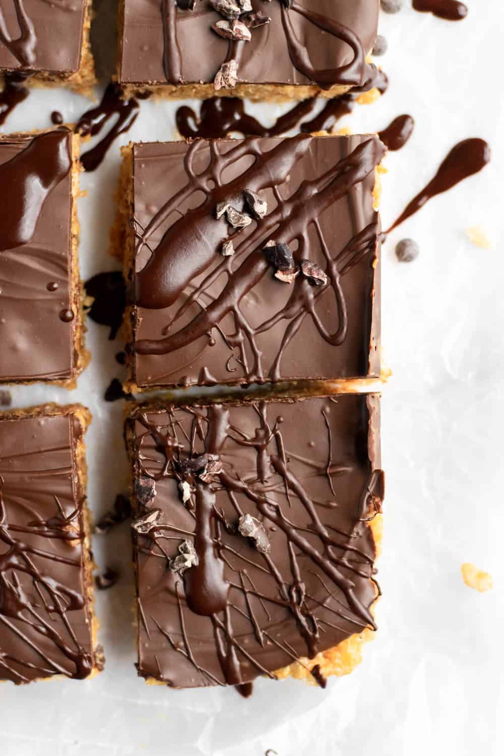 Overhead view of chocolate covered peanut butter rice krispie treats sliced.