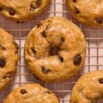 Cinnamon raisin greek yogurt bagels on cooling rack.