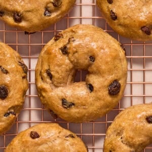 Cinnamon raisin greek yogurt bagels on cooling rack.