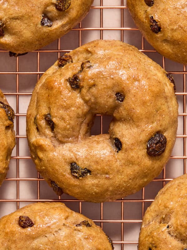 Cinnamon raisin greek yogurt bagels on cooling rack.