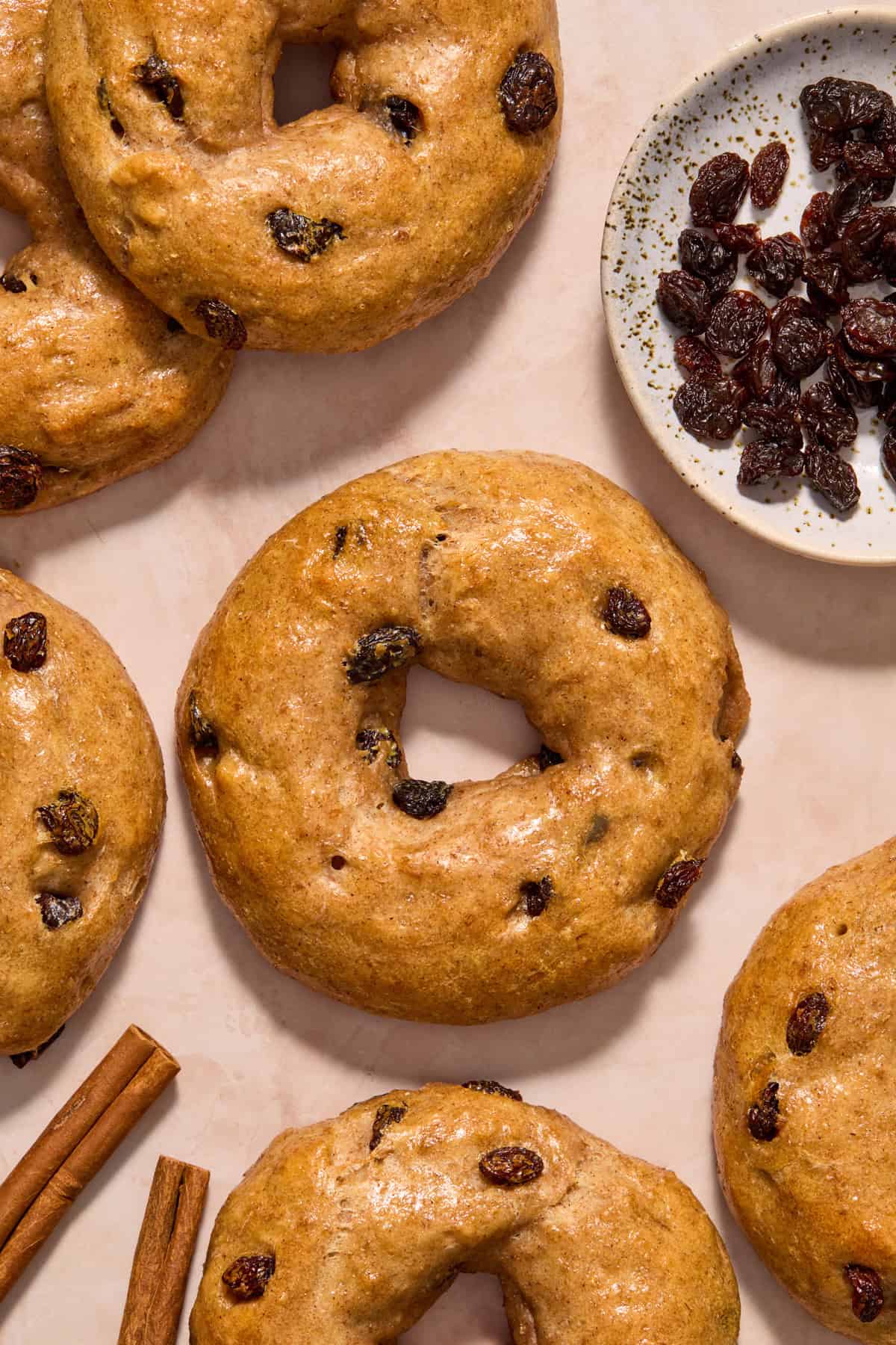 Overhead view of homemade greek yogurt raisin and cinnamon bagels.
