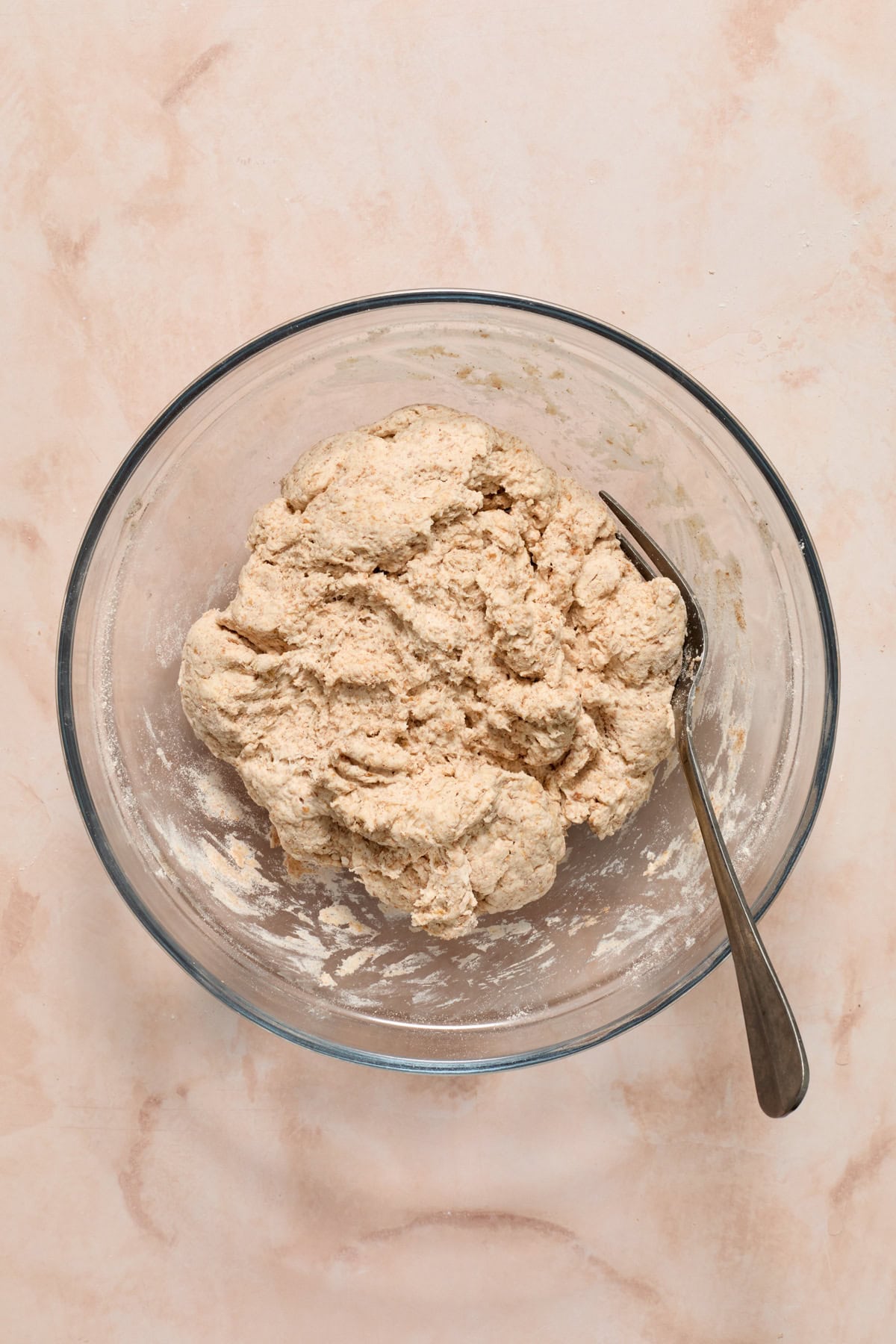 Dough for greek yogurt cinnamon raisin bagels in bowl before raisins added.