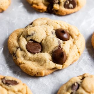Chocolate chip cookies on parchment.