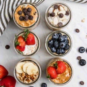 Overhead view of 6 jars of overnight oatmeal.