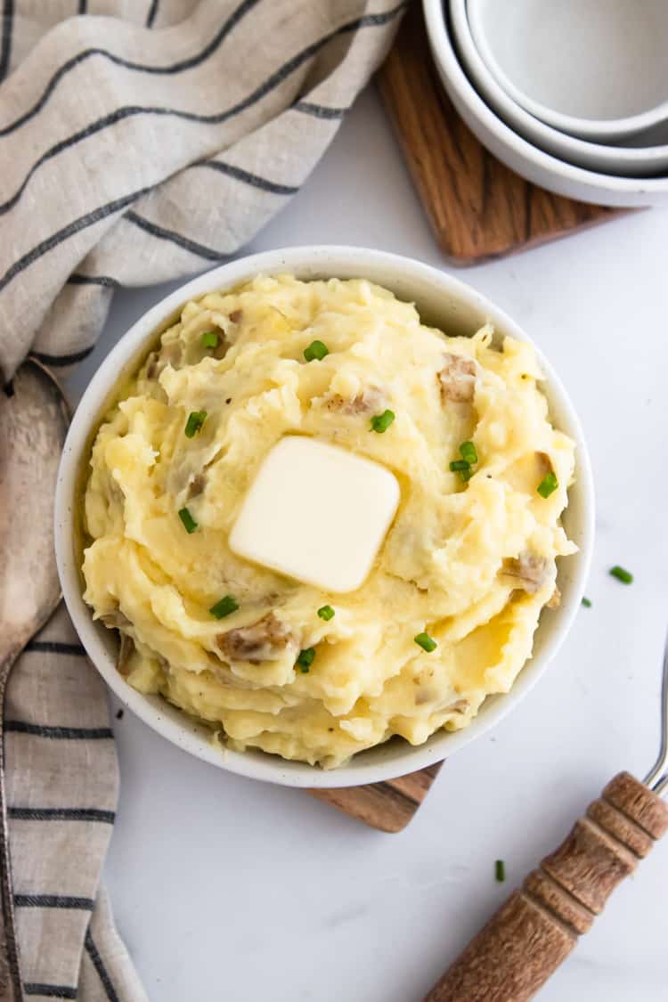 Overhead shot of mashed potatoes with butter.