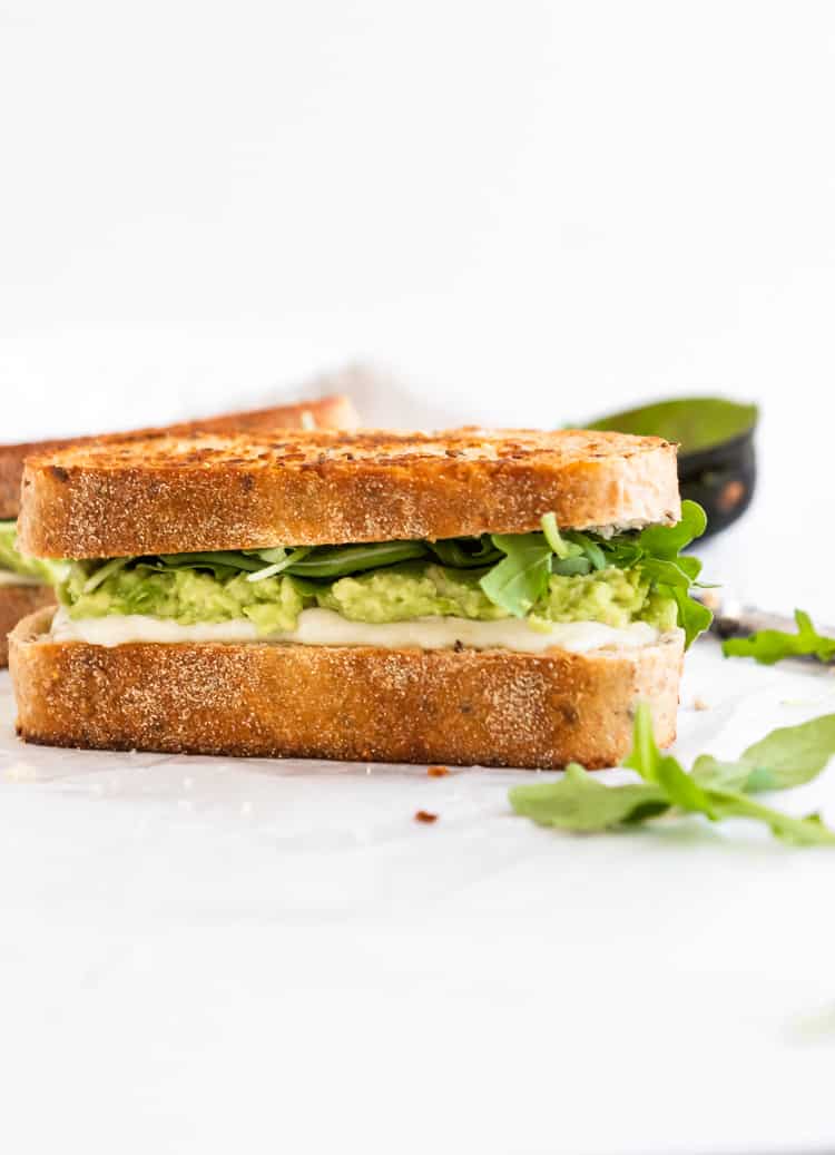 Grilled cheese sandwich with Havarti, avocado and baby arugula.