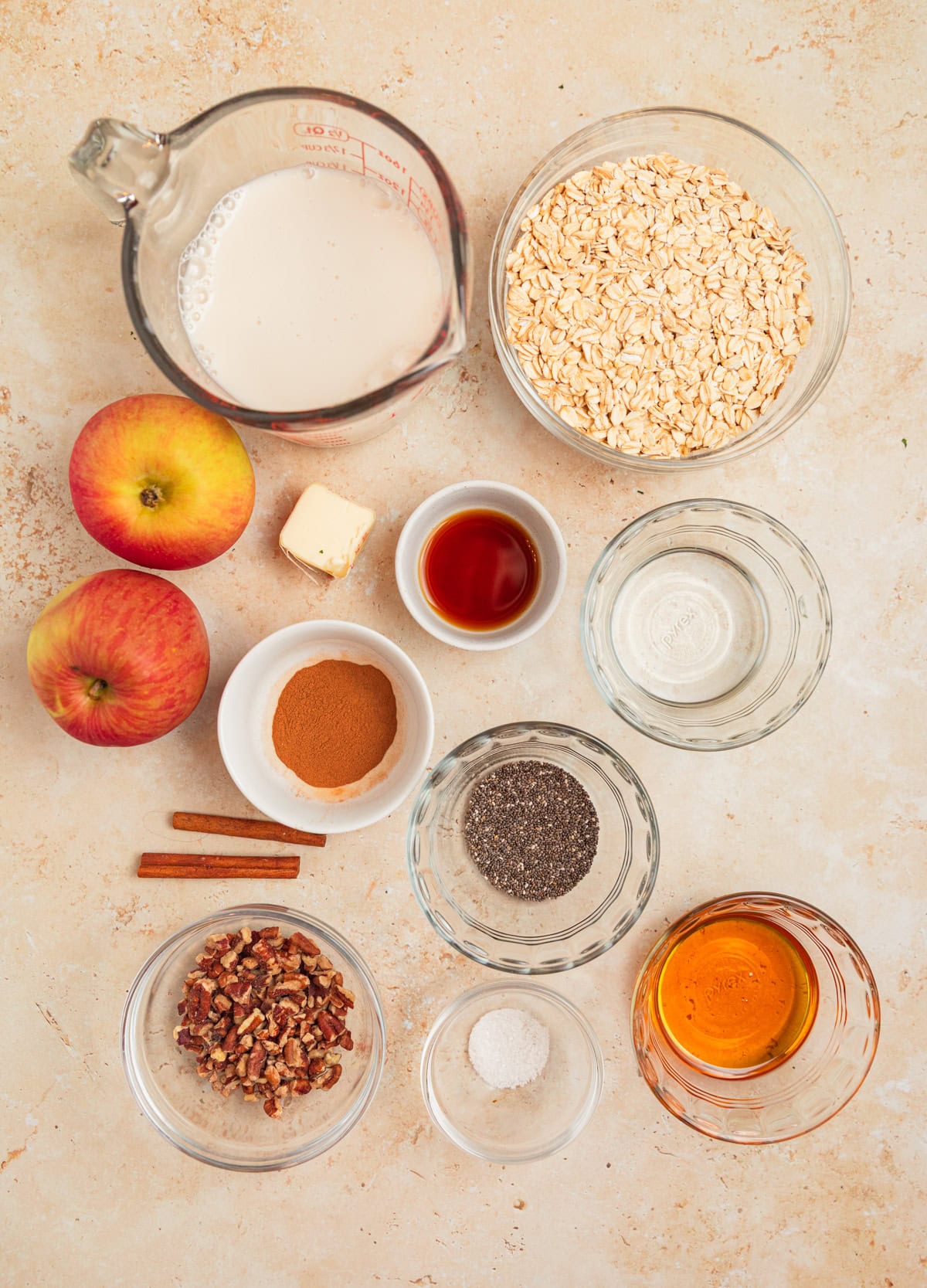 Apples, milk, maple syrup, and other ingredients laid out for recipe.