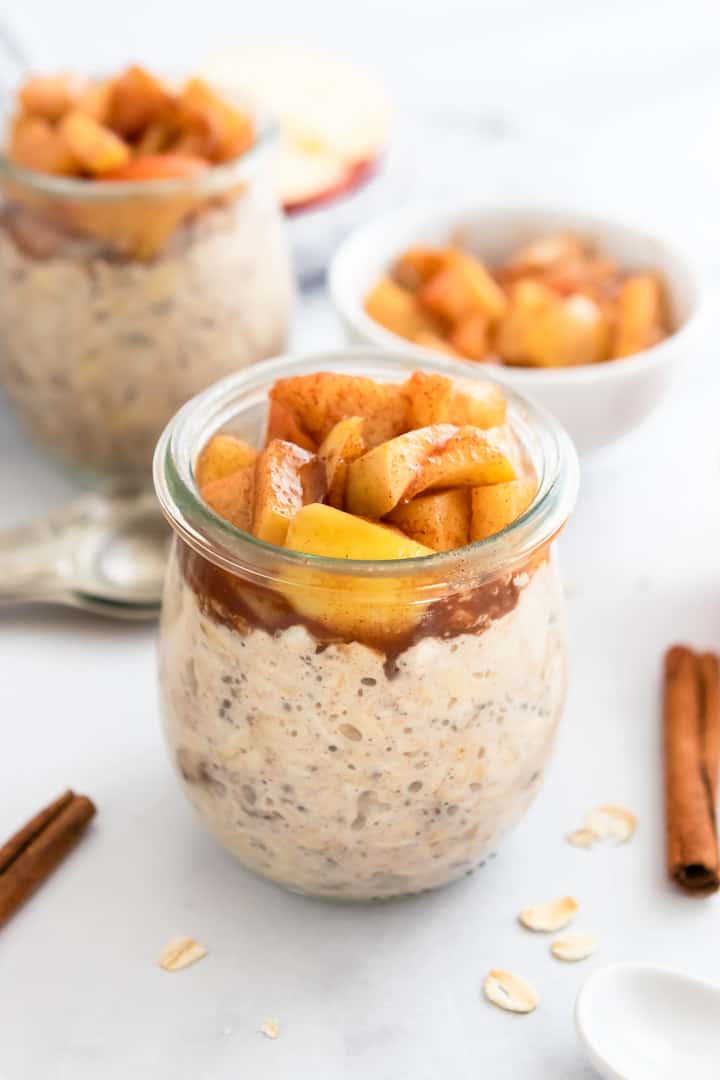 Apple Pie Overnight Oats in glass jars.