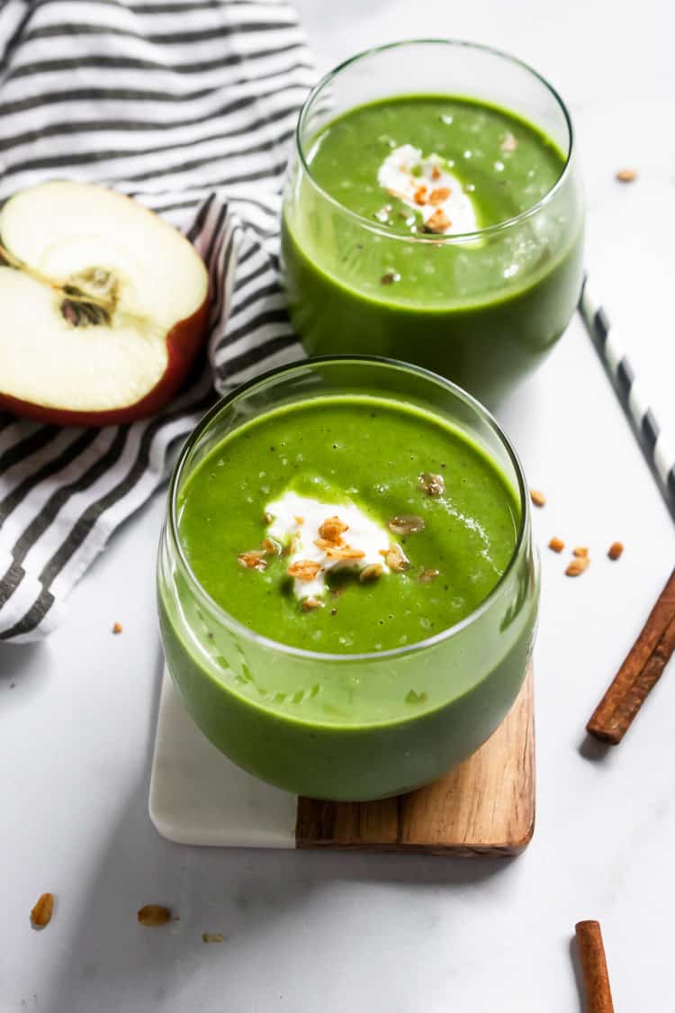 Apple green smoothies in glasses.