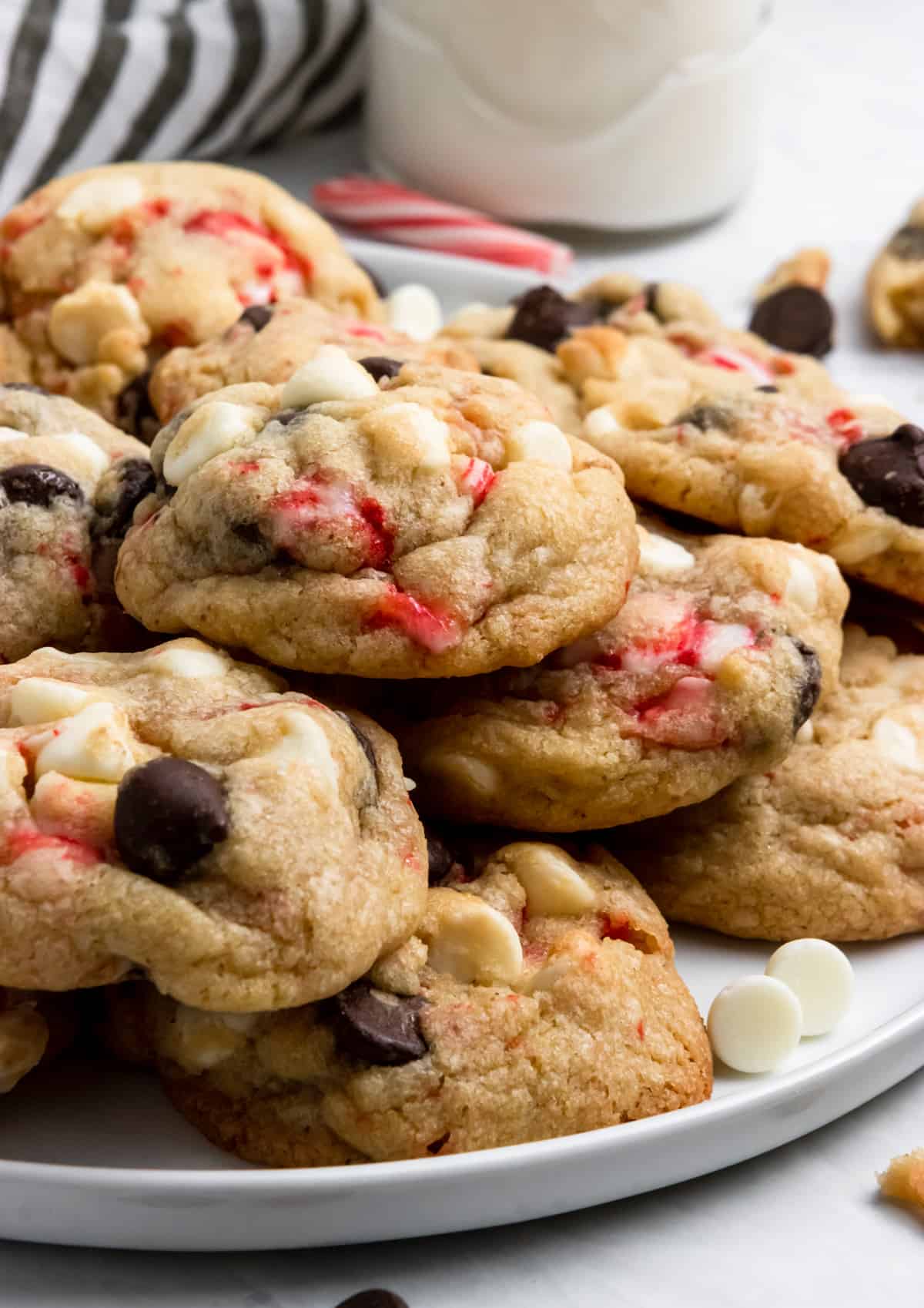 Plate of cookies with milk and white chocolate chips.