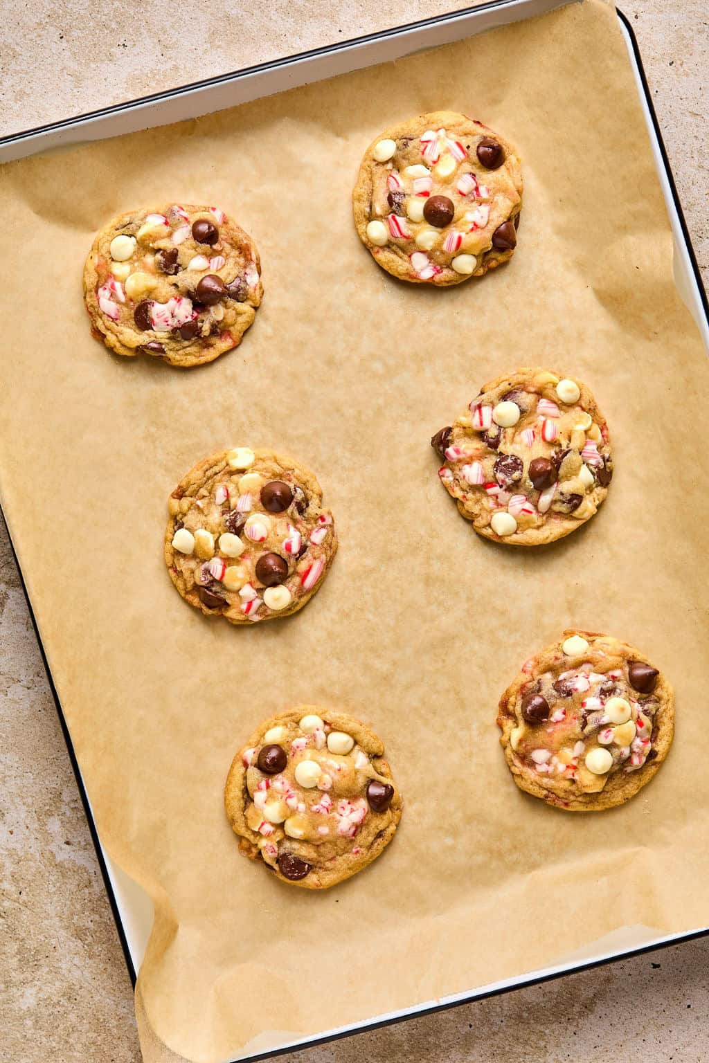 Baked peppermint chocolate chip cookies on pan.