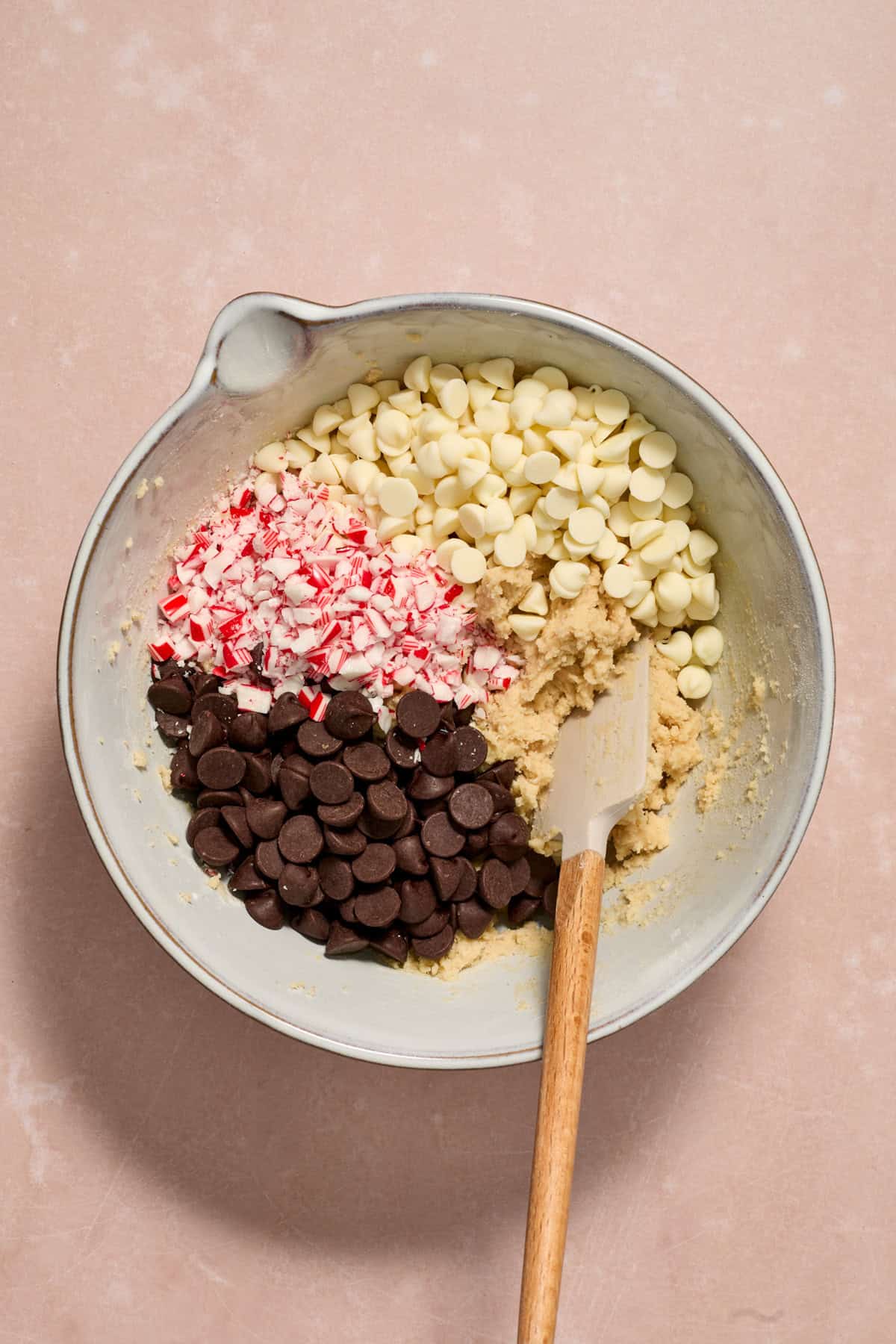 White and dark chocolate chips and crushed peppermint candy canes added to mixing bowl.