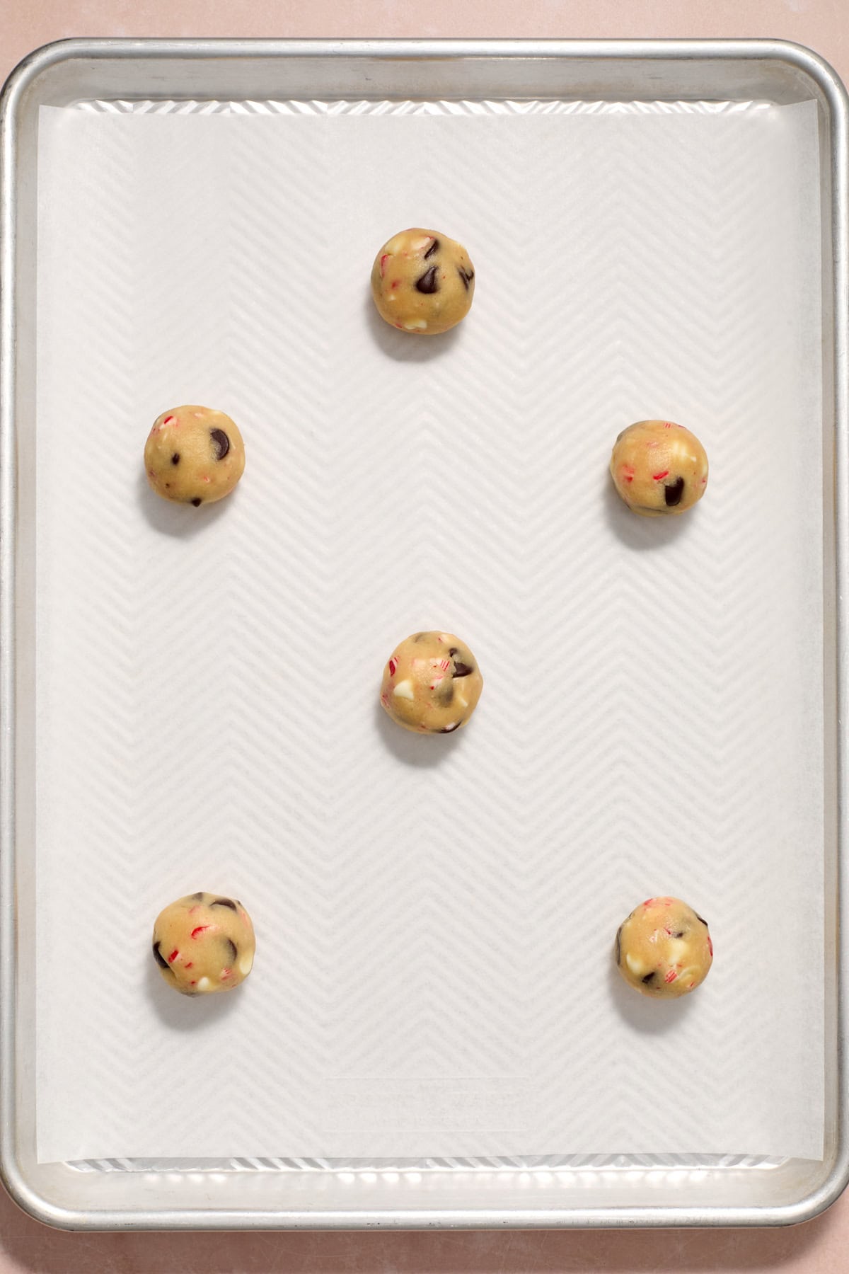 Rolled cookie dough on parchment lined pan.