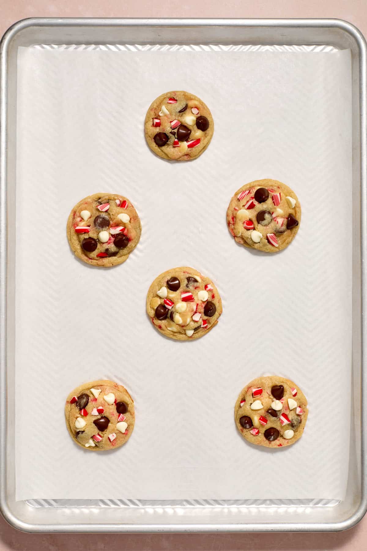 Baked peppermint chocolate chip cookies on pan.