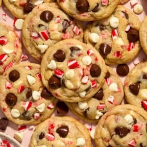 Candy cane chocolate chip cookies arranged on surface.