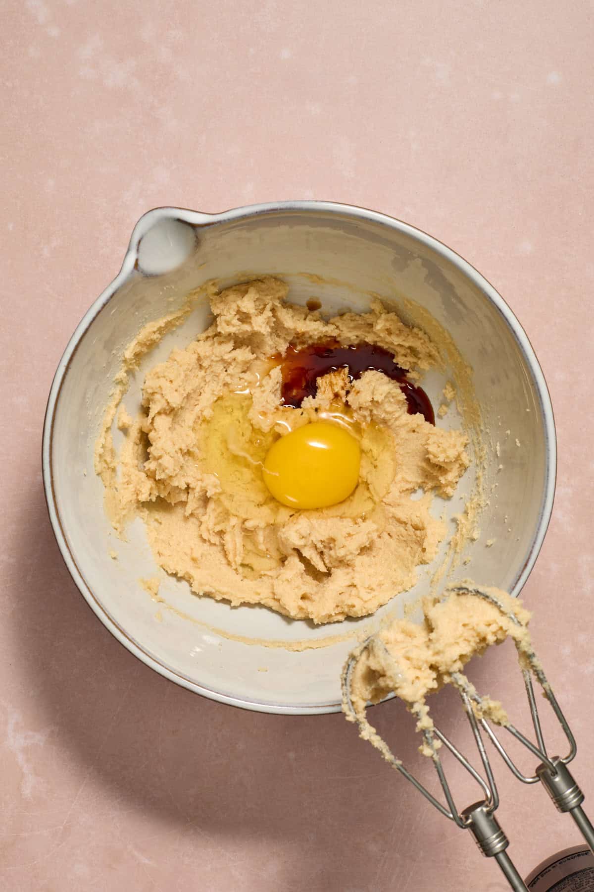 Egg and vanilla added to mixing bowl.
