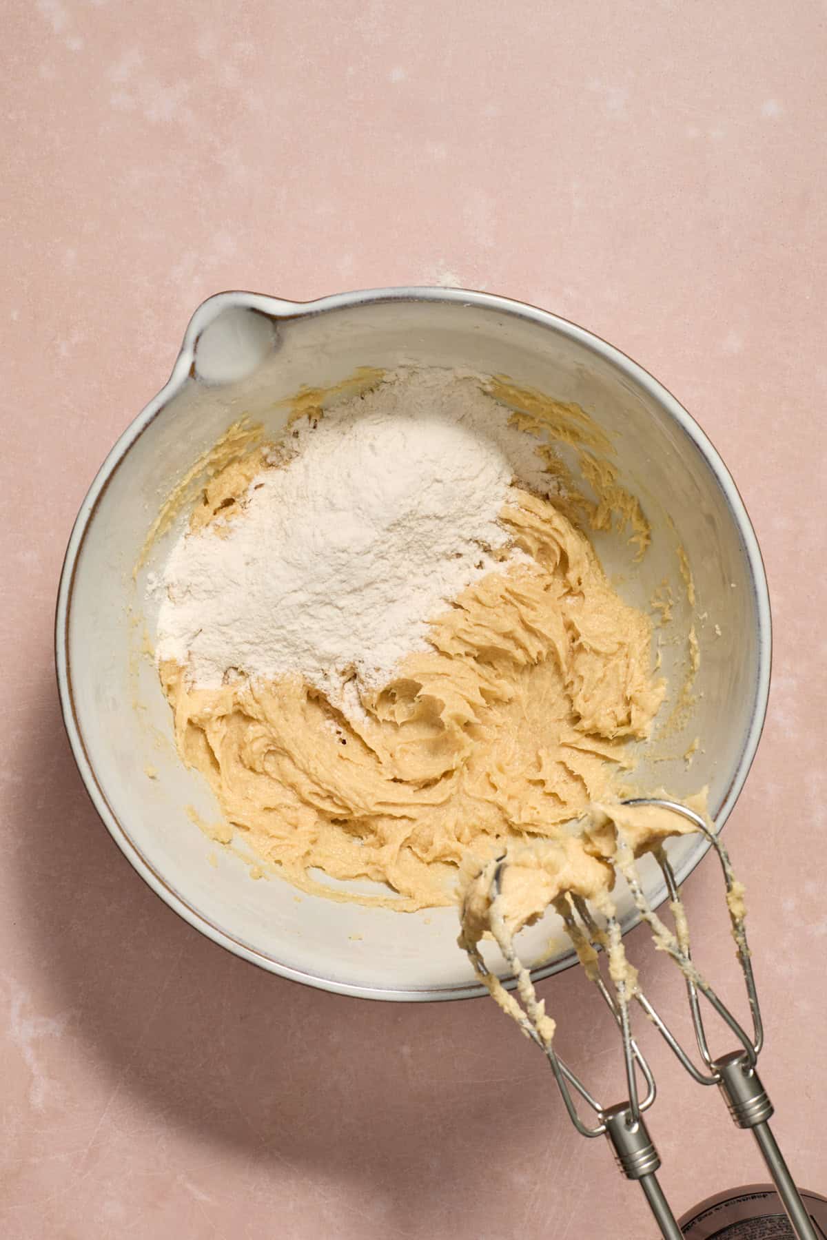 Dry ingredients added to bowl with wet ingredients.