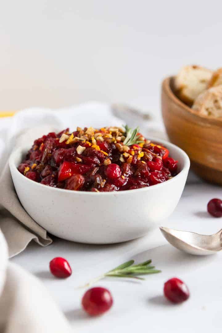 Balsamic Cranberry Chutney recipe with bread bowl and spoon.