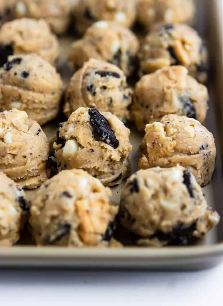 Loaded Cookies and Cream Cookie dough on pan.