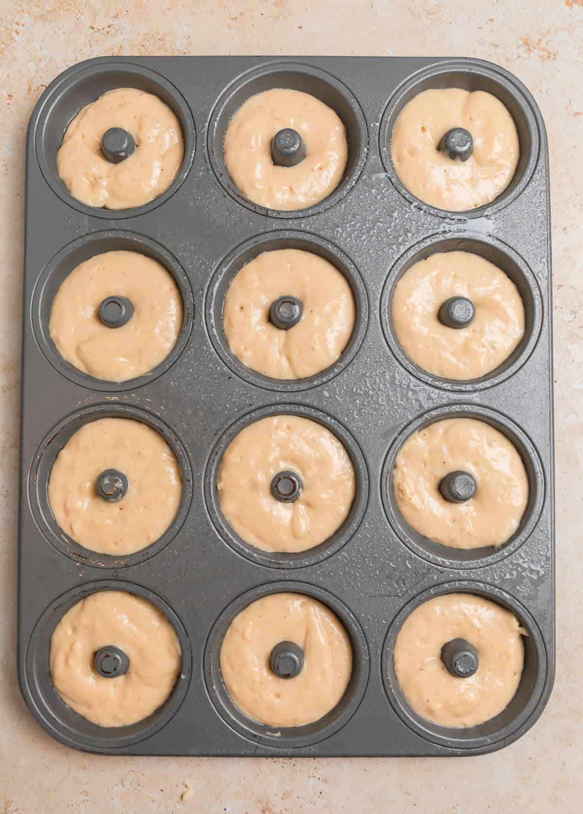 Donut pan with batter before baking.