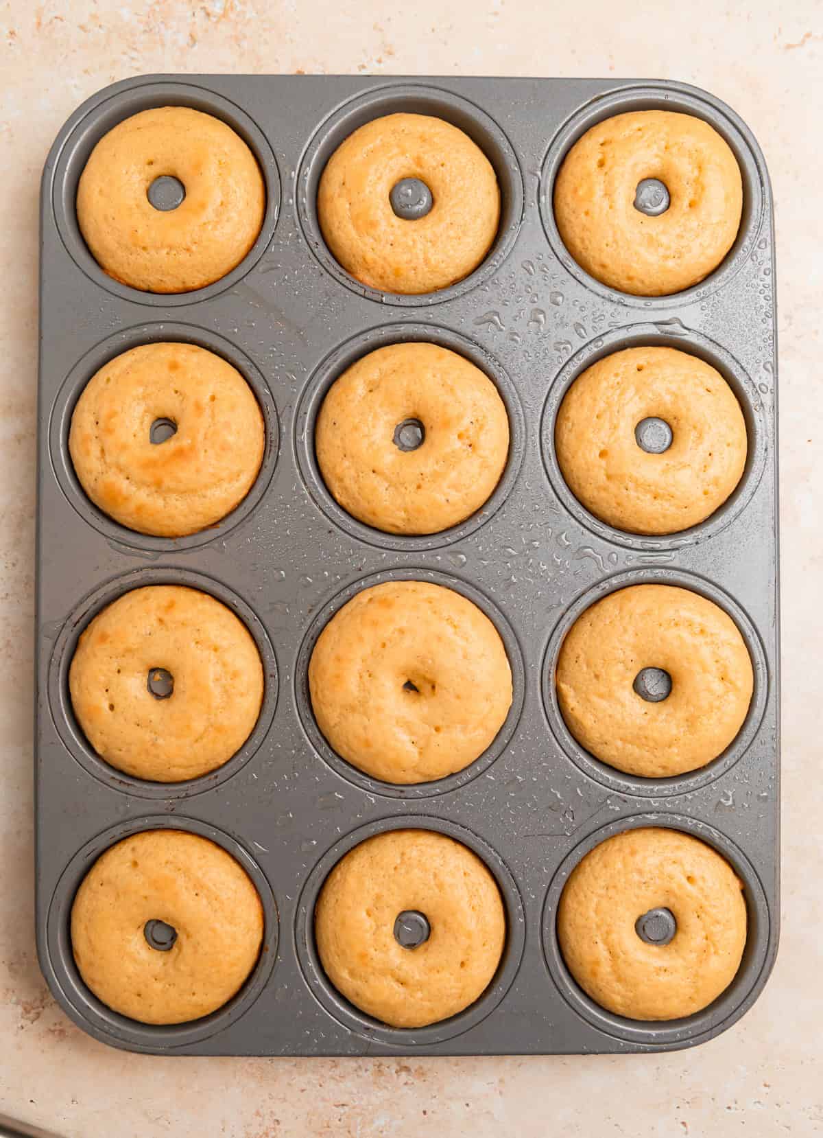 Baked Greek yogurt donuts in donut pan.