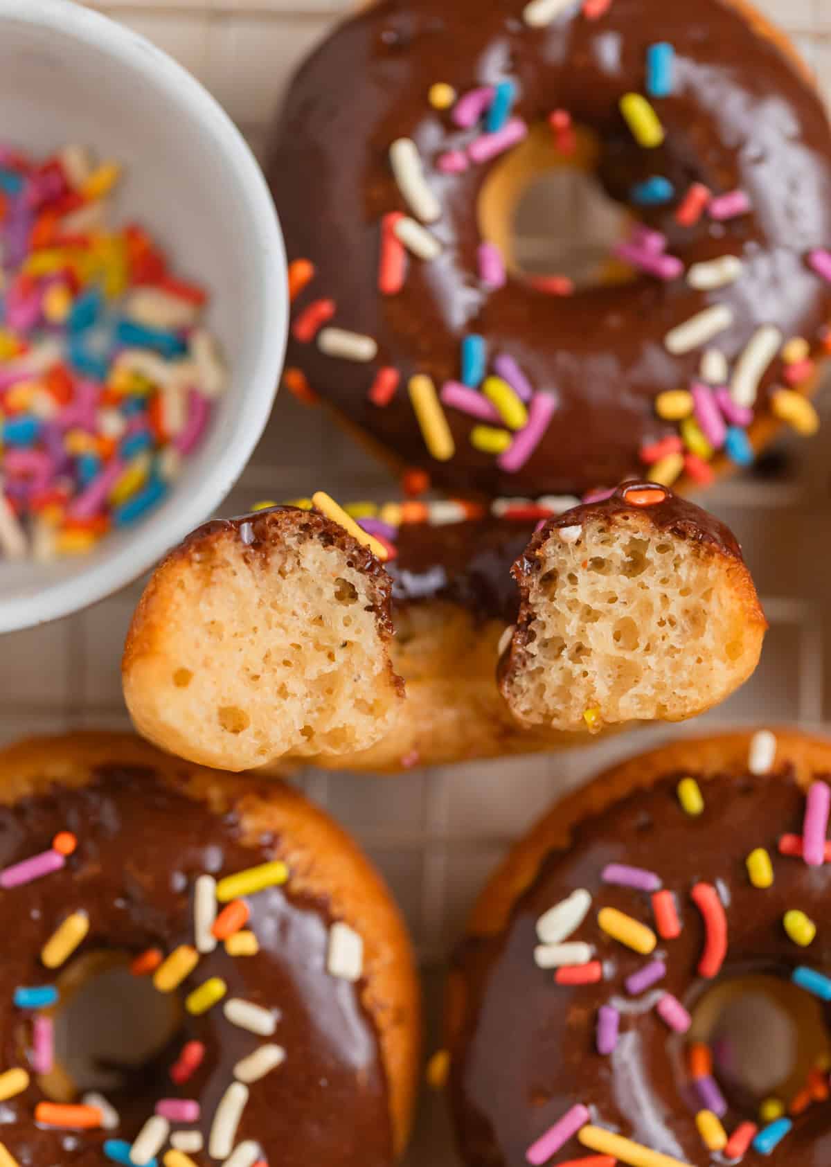 Half of a Greek yogurt donut propped to show texture.