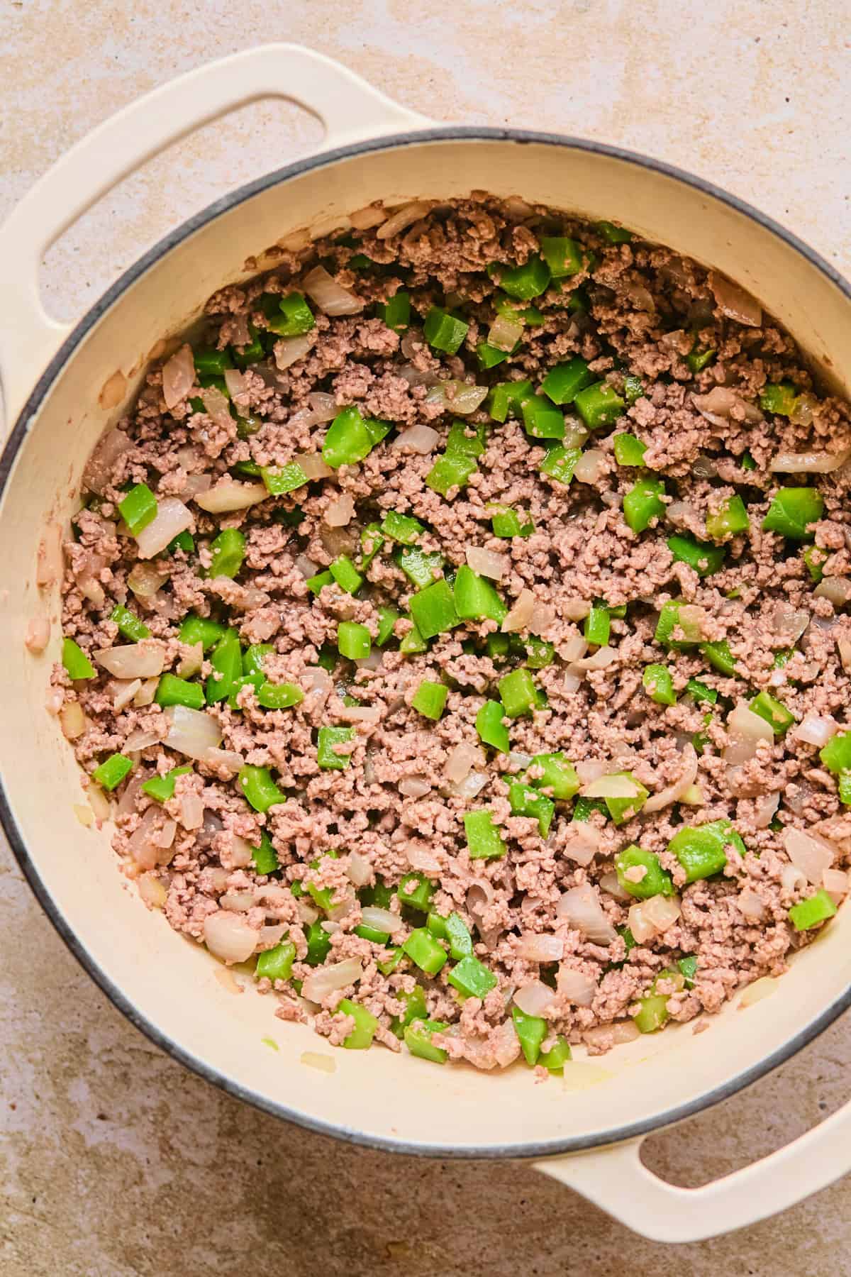 Browned meat and veggies in stock pot.