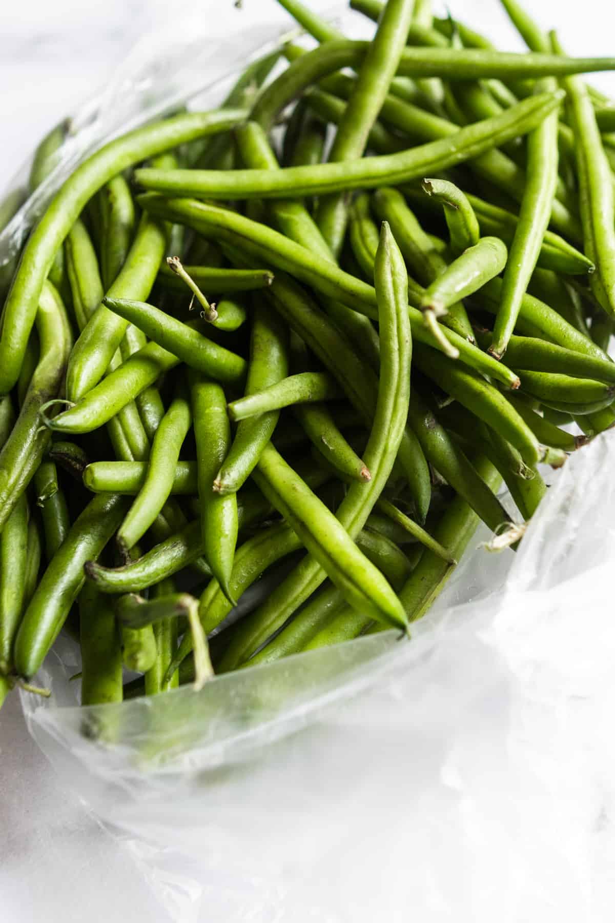 Fresh green beans in plastic bag.