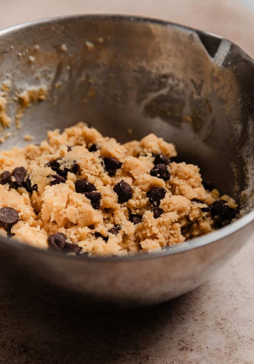 Small batch chocolate chip cookie dough in mixing bowl.