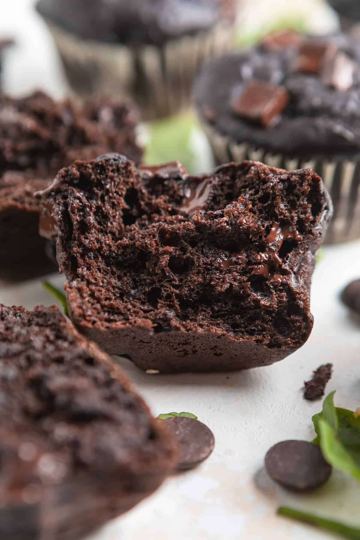 Chocolate green smoothie muffin with bite taken.
